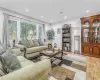 Living area with recessed lighting and light wood-type flooring