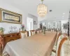 Dining space featuring recessed lighting, visible vents, a notable chandelier, and wood finished floors