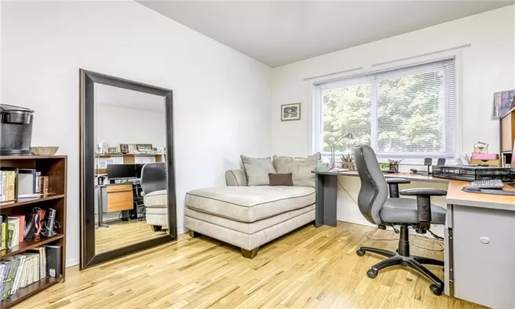 Office area featuring light wood-style floors