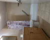 Bathroom with tile patterned floors, shower / bath combo with shower curtain, toilet, and vanity