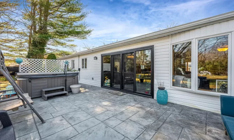 View of patio / terrace with a hot tub