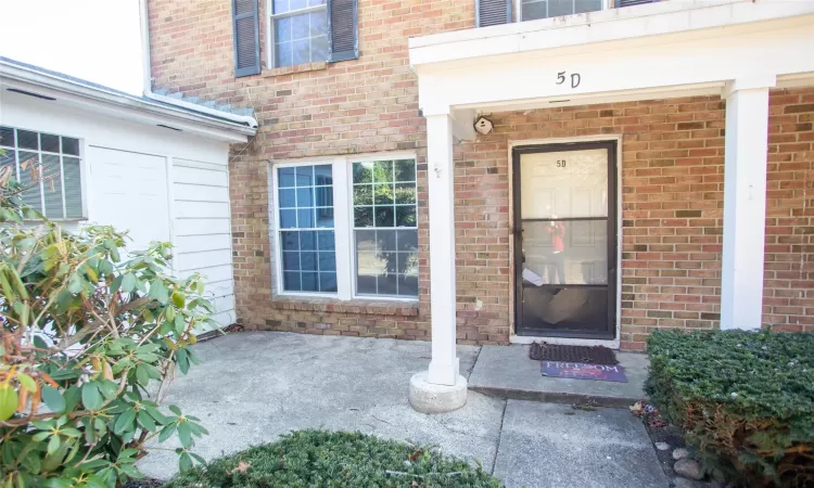 Property entrance with brick siding