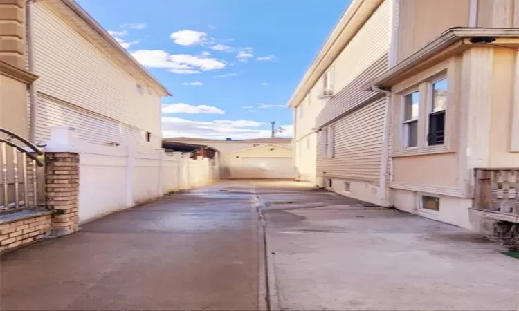 View of home's exterior, driveways that fits 4c vehicles , plus 1 car detached garage