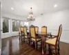 Dining area featuring crown molding, recessed lighting, and dark wood-style floors