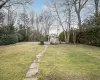 View of yard with a pool and an outdoor structure