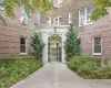 Entrance to property featuring brick siding