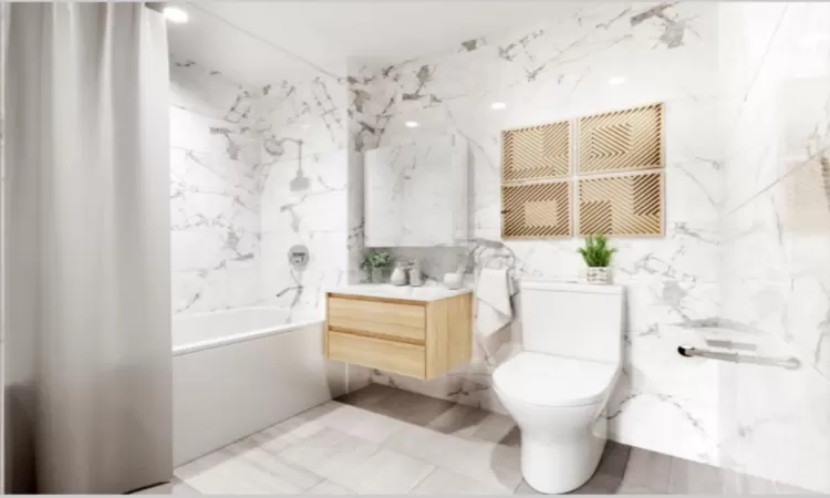 Full bathroom featuring shower / tub combo, vanity, toilet, and tile walls