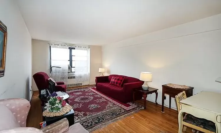 Living area with hardwood / wood-style floors