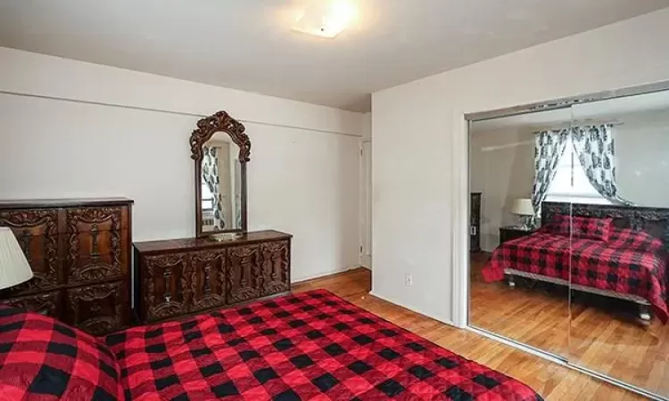 Bedroom with wood finished floors