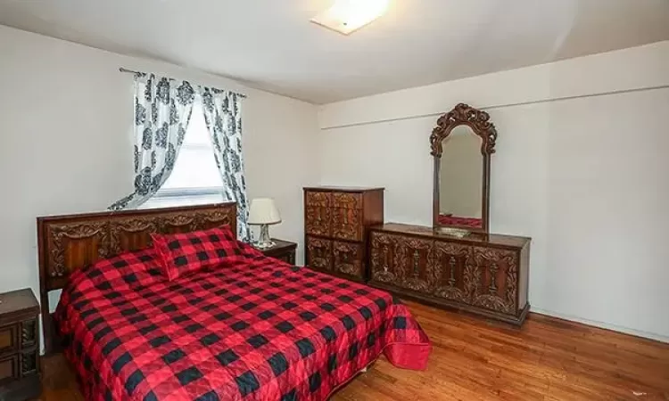 Bedroom featuring wood finished floors