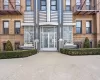 View of exterior entry featuring brick siding