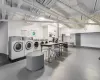 Shared laundry area featuring baseboards and independent washer and dryer