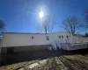 Rear view of house with a wooden deck