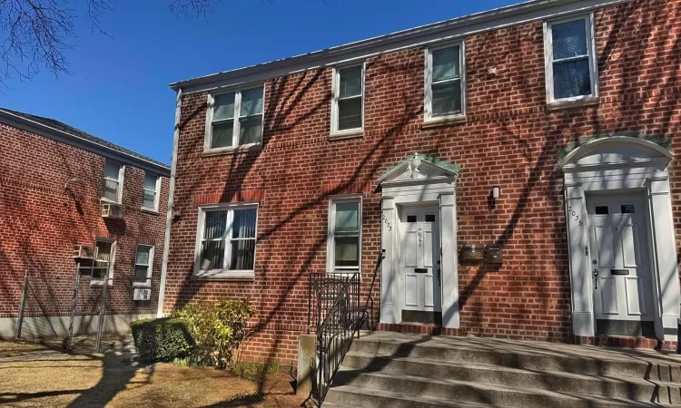 View of front of property with brick siding