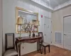 Entrance foyer with visible vents, wood finished floors, and crown molding