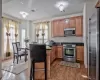 Kitchen featuring a peninsula, visible vents, dark wood-type flooring, and stainless steel appliances