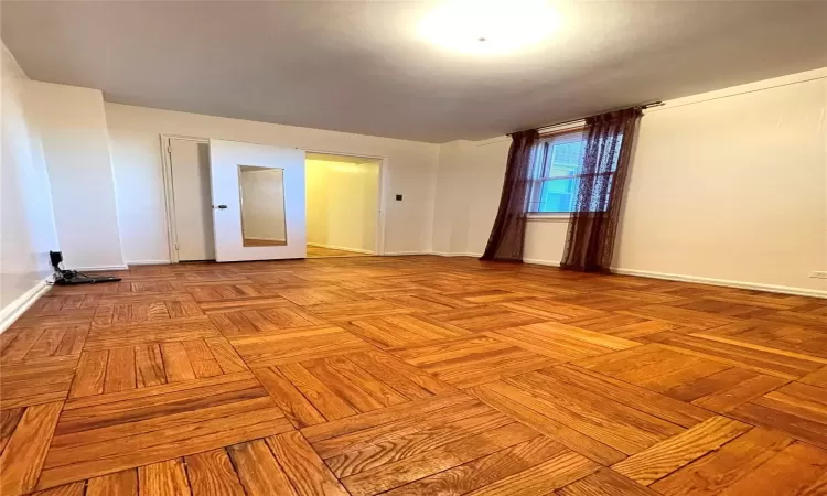 Spare room featuring baseboards