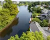 Aerial view featuring a residential view and a water view