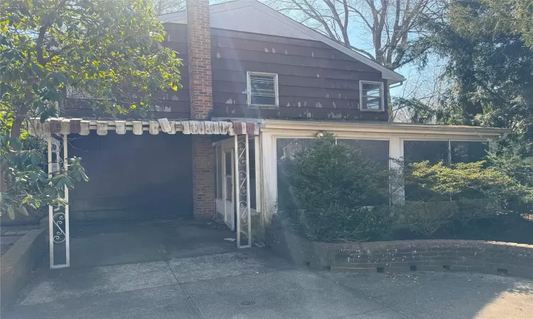 View of home's exterior with a chimney