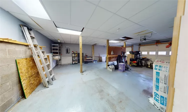 Garage with concrete block wall and a garage door opener