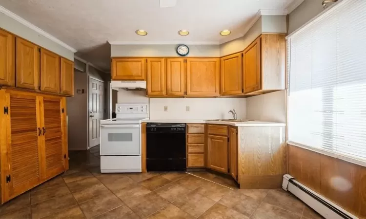 Kitchen with a baseboard heating unit, white range with electric cooktop, under cabinet range hood, dishwasher, and a sink