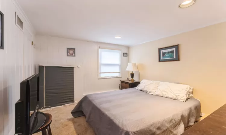 Bedroom featuring visible vents, recessed lighting, and carpet floors