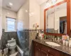 Full bath with a baseboard heating unit, tile walls, toilet, and visible vents