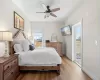 Bedroom with baseboards, access to exterior, a ceiling fan, and light wood finished floors