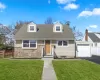 View of front of property with new asphalt driveway