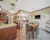 Dining area featuring crown molding, light tile patterned floors, visible vents, and a baseboard radiator