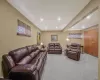 Living area with carpet flooring and recessed lighting