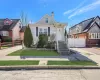 Bungalow-style house featuring fence, driveway, and a chimney