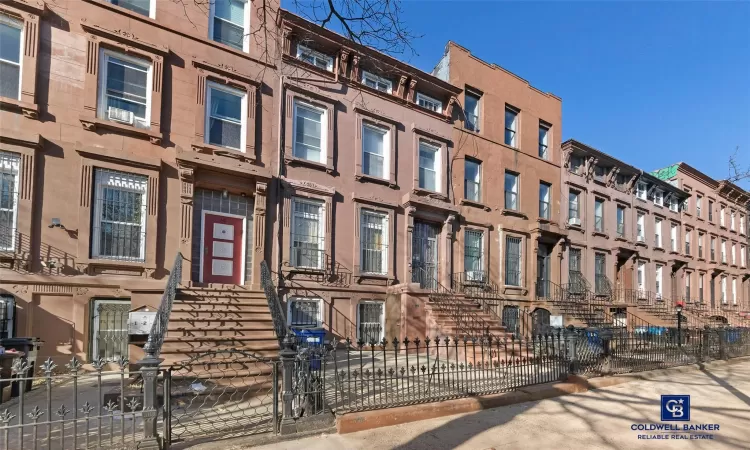 View of property with a fenced front yard