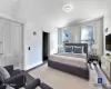 Bedroom featuring crown molding, baseboards, and wood finished floors