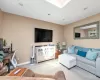 Living room with recessed lighting, a skylight