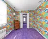 Bedroom featuring  crown molding, radiator heating unit, and carpet floors