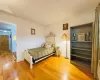 Bedroom with baseboards and wood-type flooring