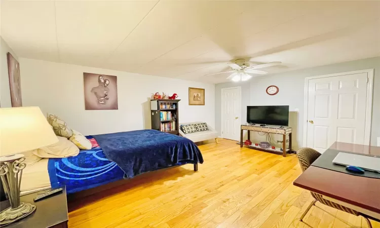 Bedroom featuring ceiling fan and light wood finished floors