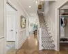 Foyer with Herringbone Hardwood Floors and Two Coat Closets