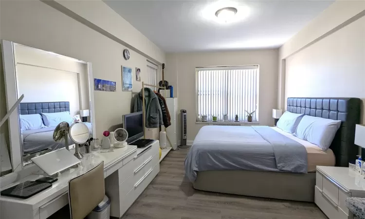 Bedroom with light wood-type flooring