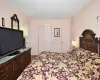 Bedroom featuring a closet and dark wood-style flooring