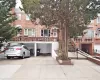 Multi unit property featuring brick siding and concrete driveway