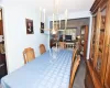 Dining area featuring dark colored carpet