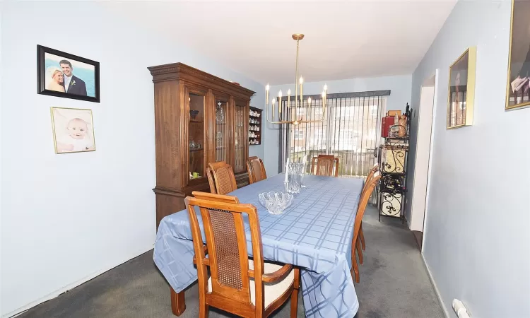 Dining area with a chandelier