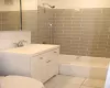 Full bathroom with visible vents, toilet, marble finish floor, shower / bath combination, and vanity