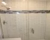 Full bathroom featuring a stall shower