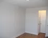 Unfurnished room with baseboards and wood finished floors