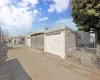 Garage featuring a gate and fence