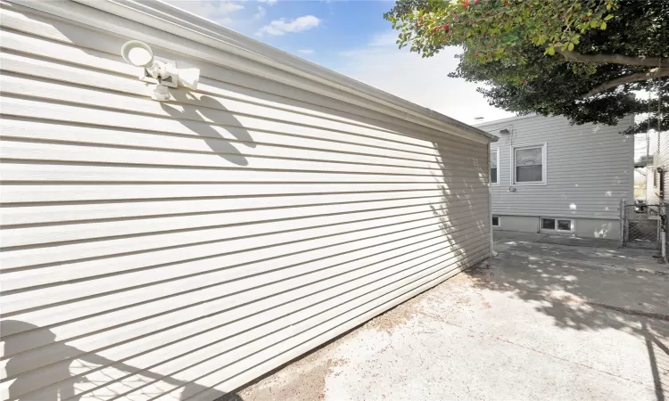 View of side of property featuring a patio