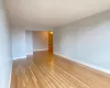 Empty room with light wood-type flooring and baseboards